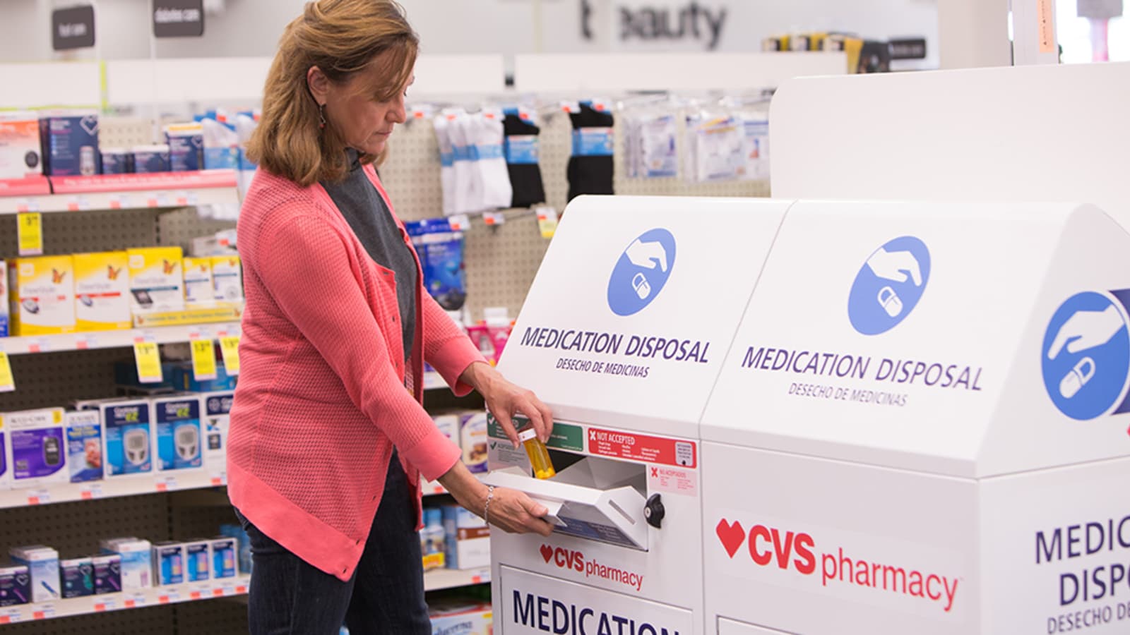 A Person Safely Disposing of Medication in a CVS location