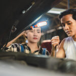 Professional mechanic technician working on the car engine in garage. auto repair service concept, maintenance inspection job to checking vehicle automobile at transport station