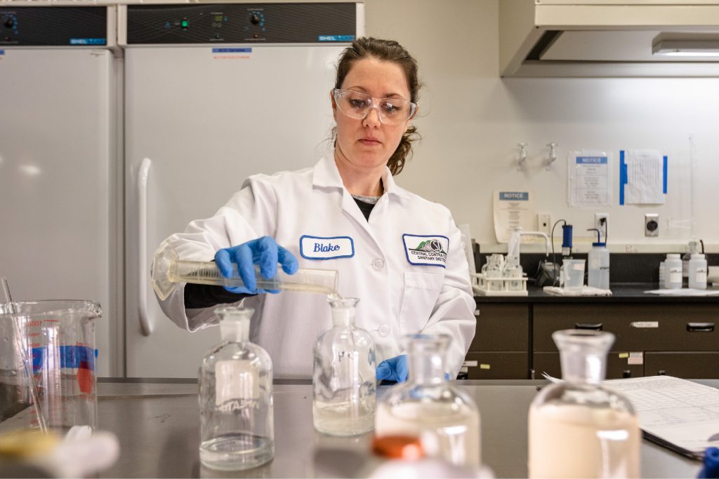 Person testing biosolids